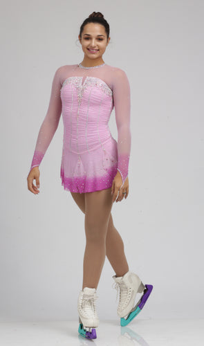 A fun/playful pink ice skating dress figure skating dress by Tania Bass